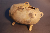  Apple Baker,1600s. This vessel was originally placed directly in the fire to bake apples. It was excavated in Bayley Lane in 1988. The fabric is Midlands yellow ware however there are also some green glaze patches which dripped on to it from other pottery